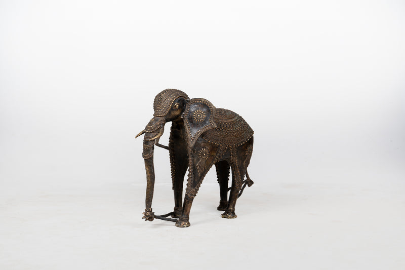 A Brass Figure of an Elephant with a Trunk Down