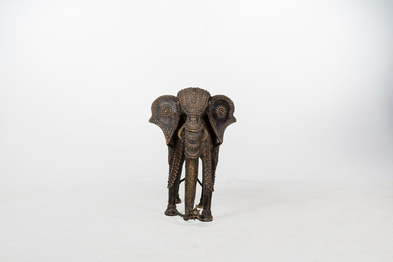 A Brass Figure of an Elephant with a Trunk Down