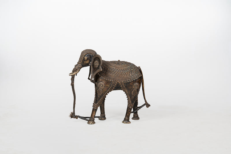 A Brass Figure of an Elephant with a Trunk Down