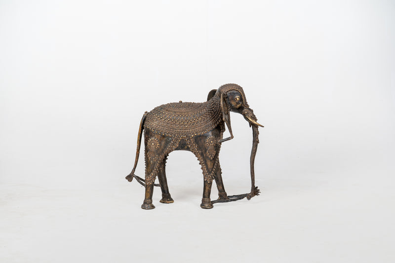 A Brass Figure of an Elephant with a Trunk Down