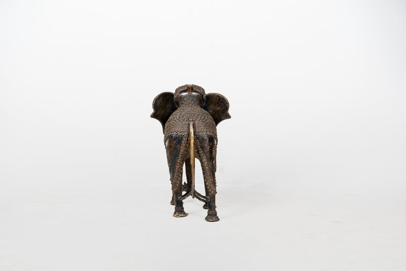 A Brass Figure of an Elephant with a Trunk Down