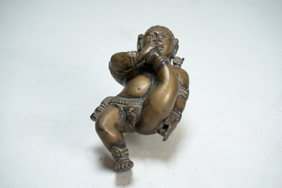 A Brass Figure of infant Krishna