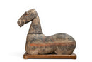 A Grey Pottery Recumbent Horse