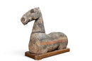 A Grey Pottery Recumbent Horse