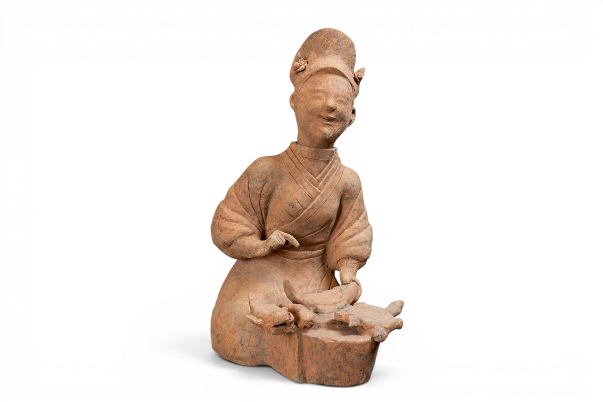 A Terra Cotta Figure of a Fish Cook