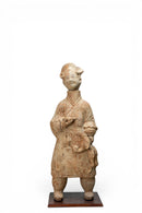 A Terracotta Figure of a Cook Holding Birds