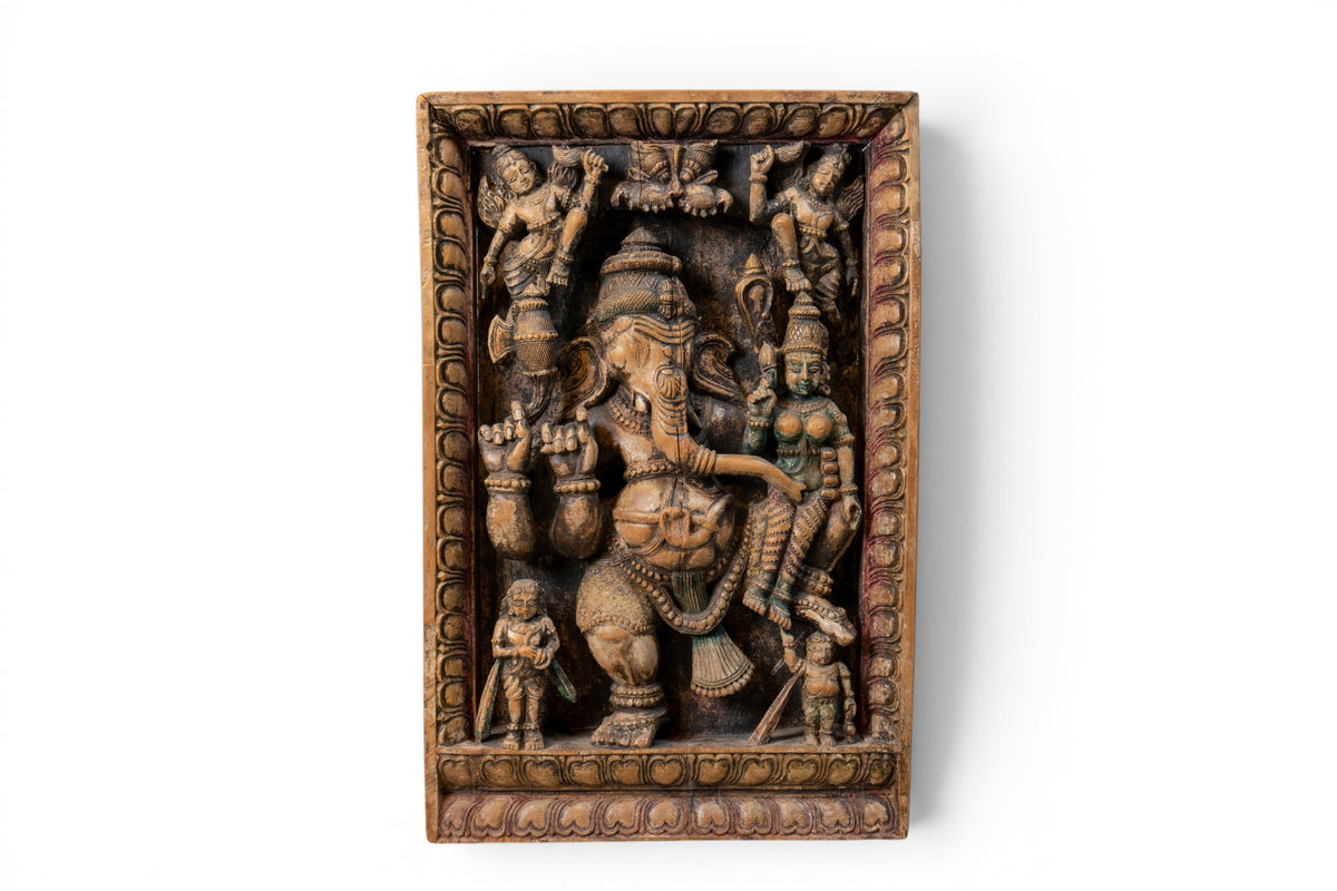 A Carved Wooden Panel of Ganesha