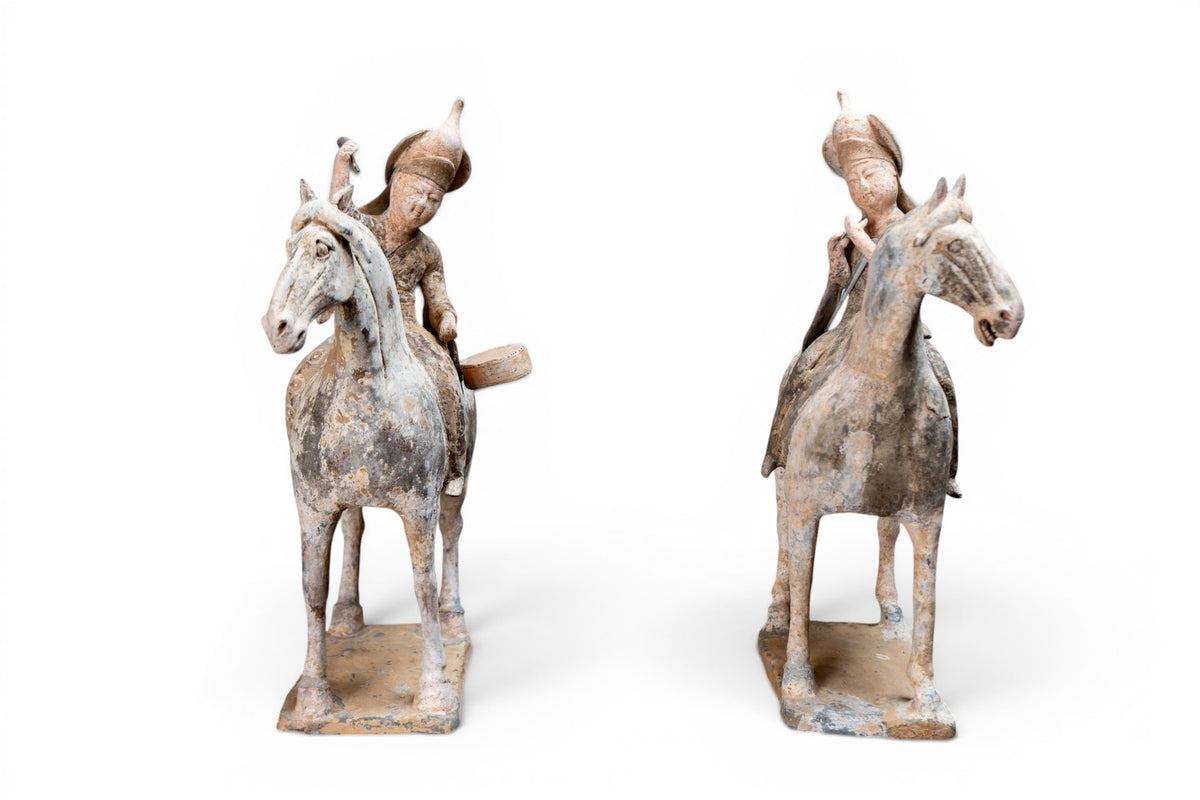 A Pair of Painted Equestrian Figures