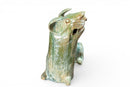 A Han Figure of a Reclining Dog