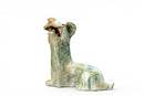 A Han Figure of a Reclining Dog