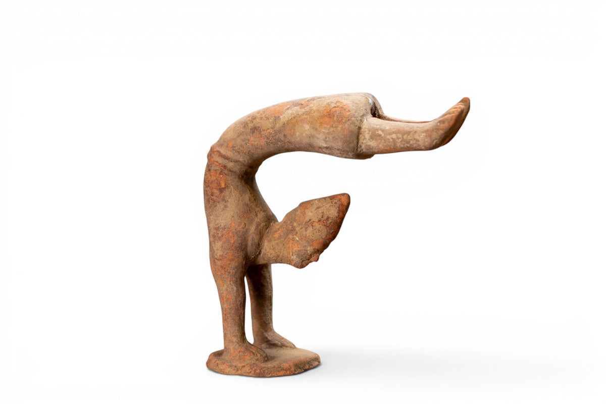 A Terracotta Acrobat Figure