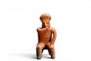 A Nayarit Protoclassic Seated Figure on a Stool