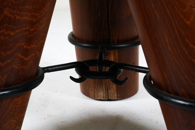 Table, three-legged with iron cuffs