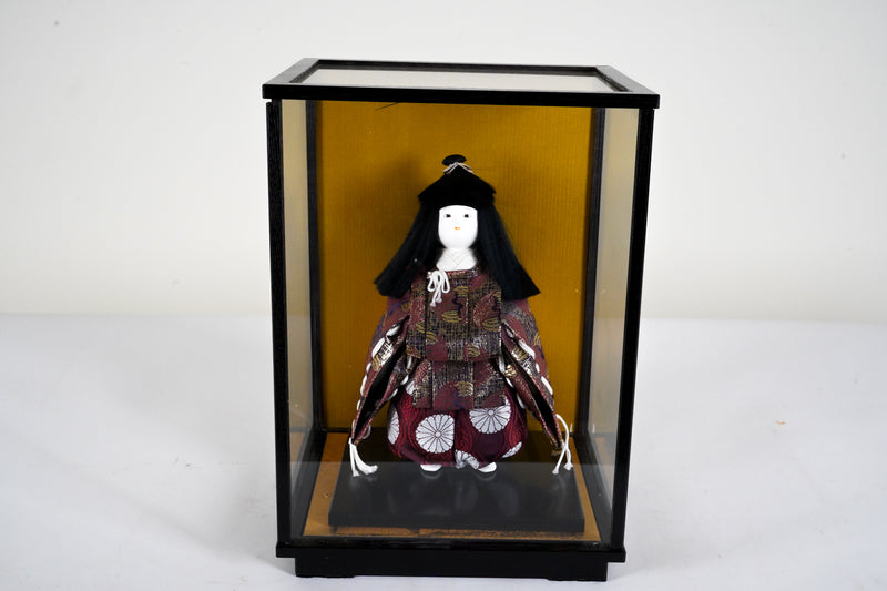 A Japanese Doll With Display