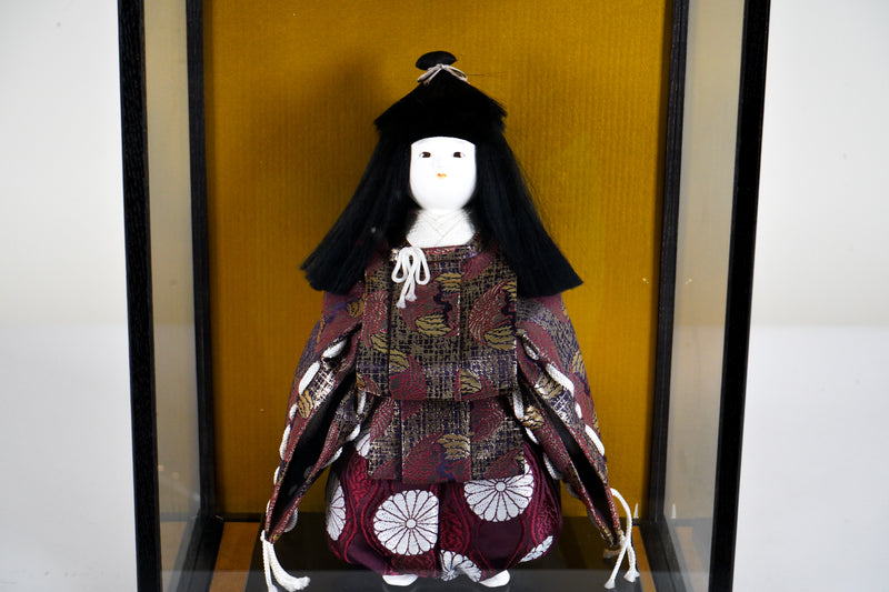 A Japanese Doll With Display