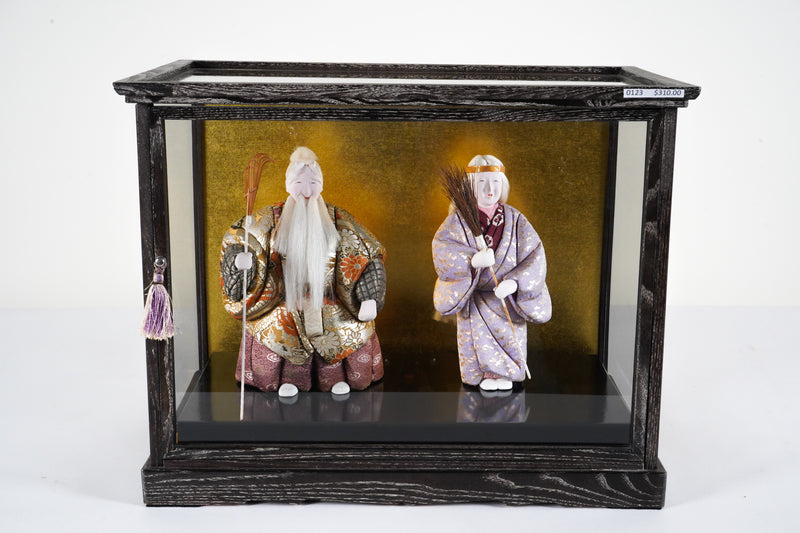 A Pair of Japanese Dolls with Display