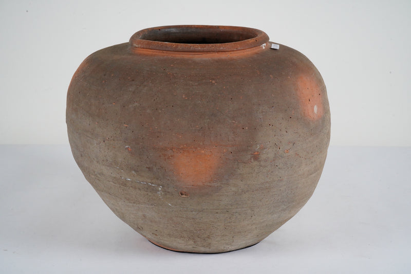 An Unglazed Ceramic Jar