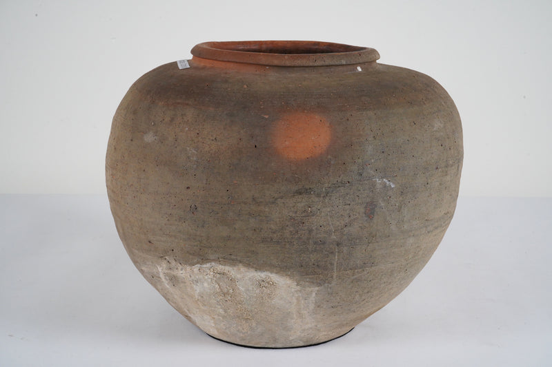 An Unglazed Ceramic Jar