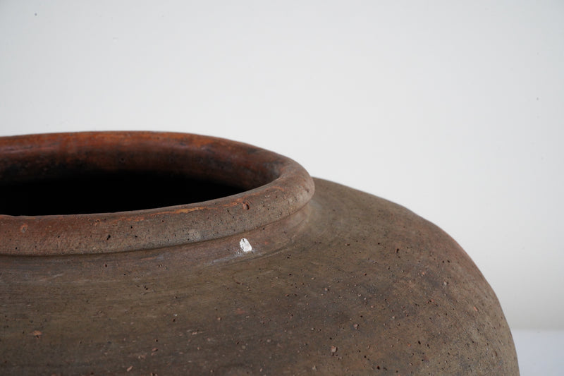An Unglazed Ceramic Jar