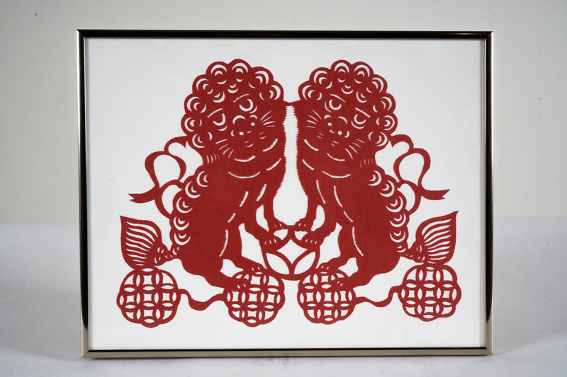 A Paper Cutout of Two Lions