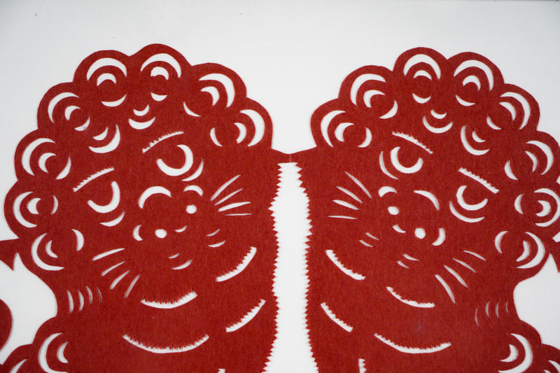 A Paper Cutout of Two Lions