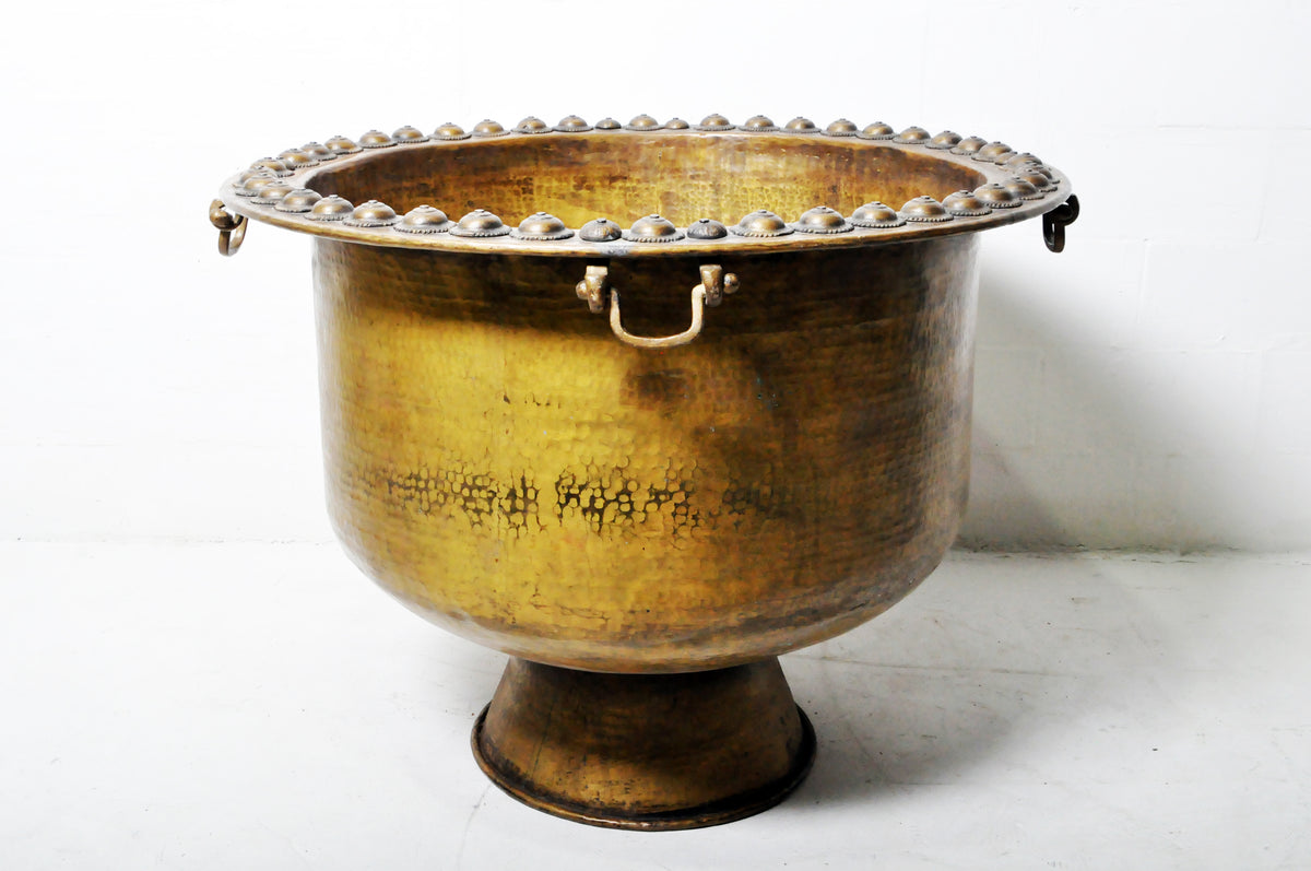 A Monumental Hammered Brass Rain Collection Bowl