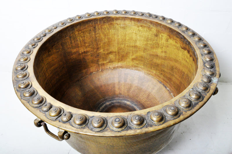 A Monumental Hammered Brass Rain Collection Bowl