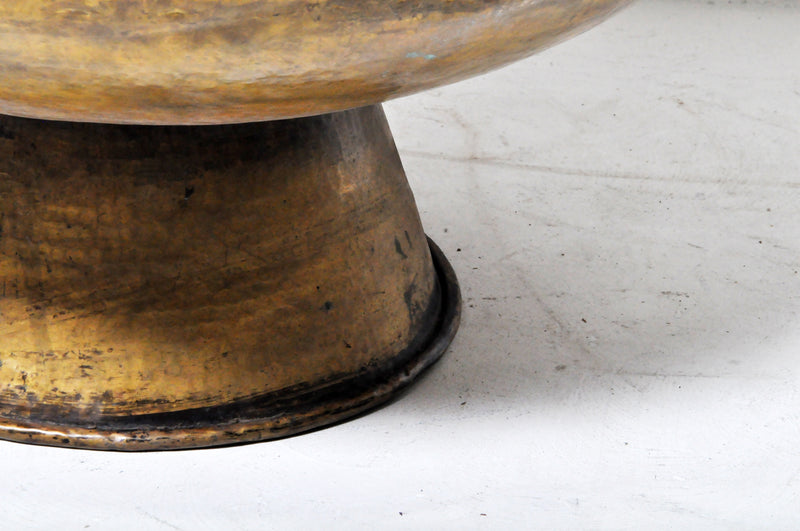 A Monumental Hammered Brass Rain Collection Bowl