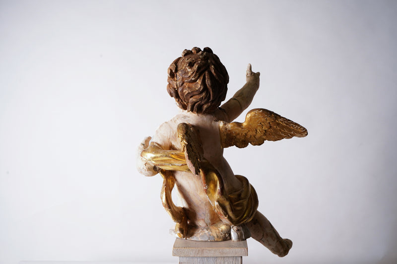 A Cherub Carved From Wood With Polychrome & Gilt