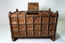 A Large Indian Storage Chest On Wheels