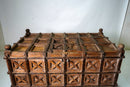 A Large Indian Storage Chest On Wheels