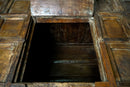 A Large Indian Storage Chest On Wheels