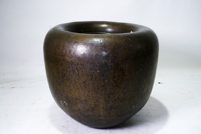 A Monumental Hammered Brass Pot