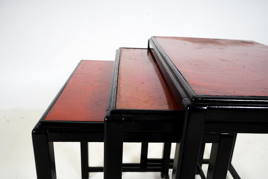 A set of 3 Nesting Side Tables with Red Lacquer Tops