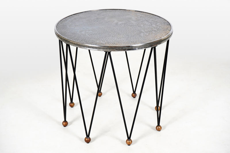 A Round Side Table with 8 Iron Legs And Embossed Metal Top