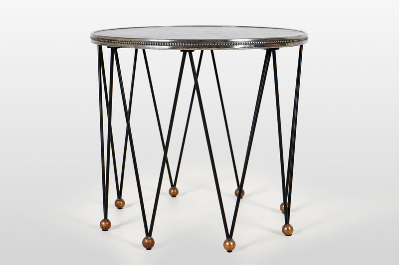 A Round Side Table with 8 Iron Legs And Embossed Metal Top