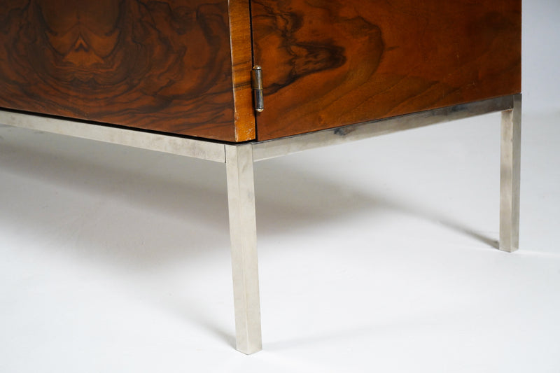 A Mid-Century Sideboard With a Stainless Steel Base and Marble Top