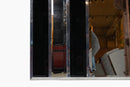 An Art Deco Style Mirror With Chrome Frame