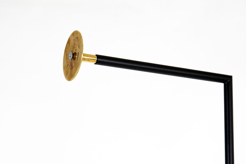 A Wall-Mounted Coat Rack In Walnut and Brass