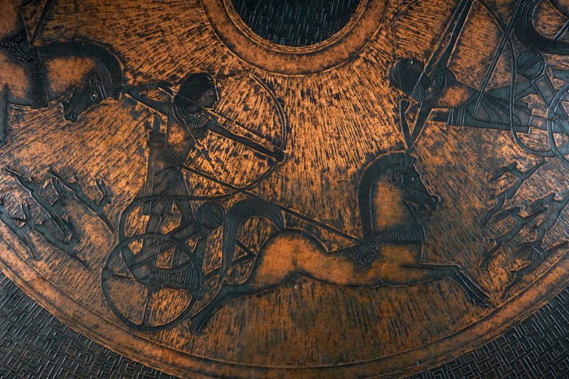 A Round Coffee Table with Embossed Top