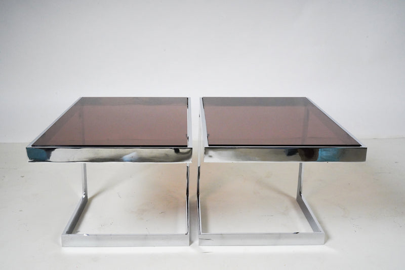 A Pair of Side Tables With Chrome Frames and Smoked Glass Tops 