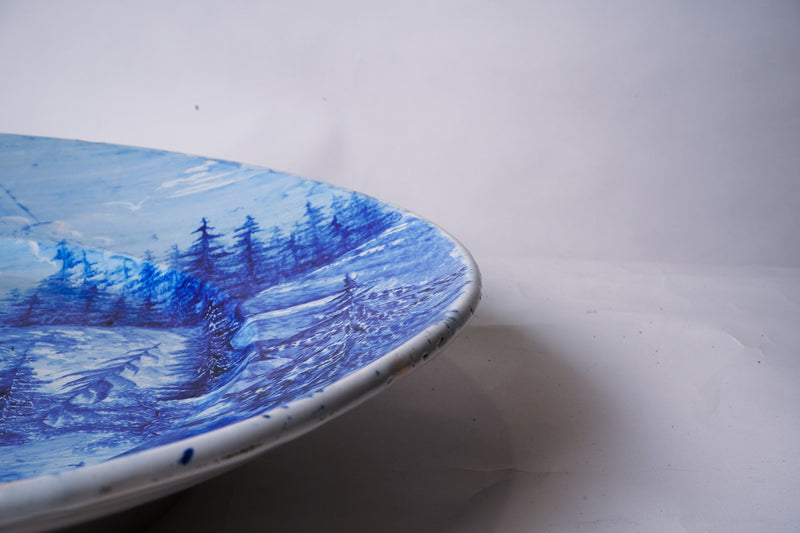 A Large Blue And White Charger